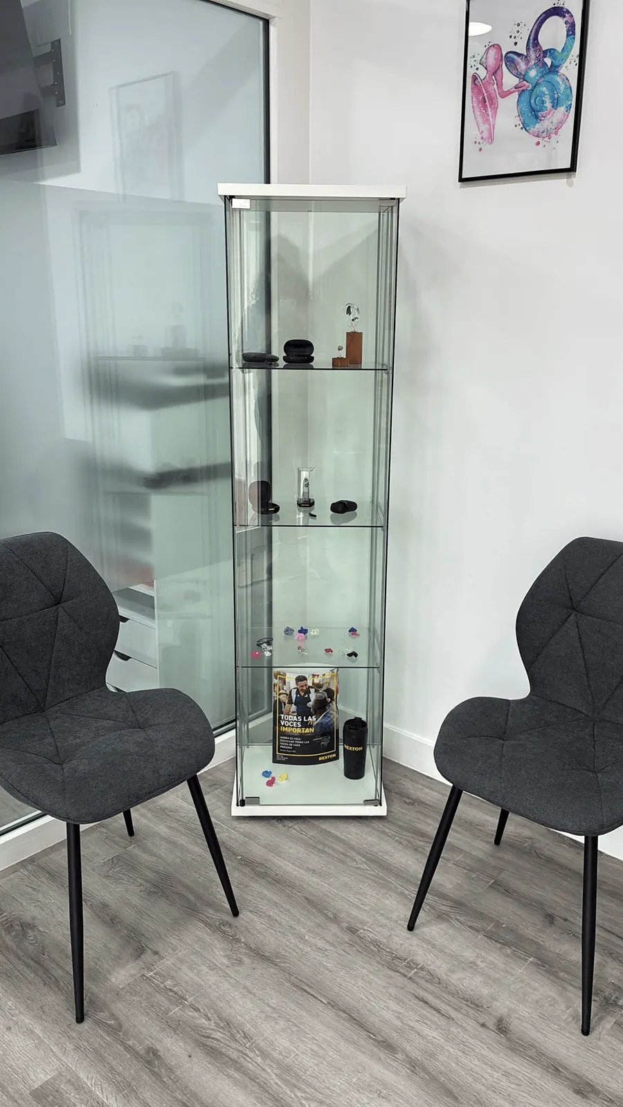 Display cabinet with hearing aids and colourful custom earmoulds